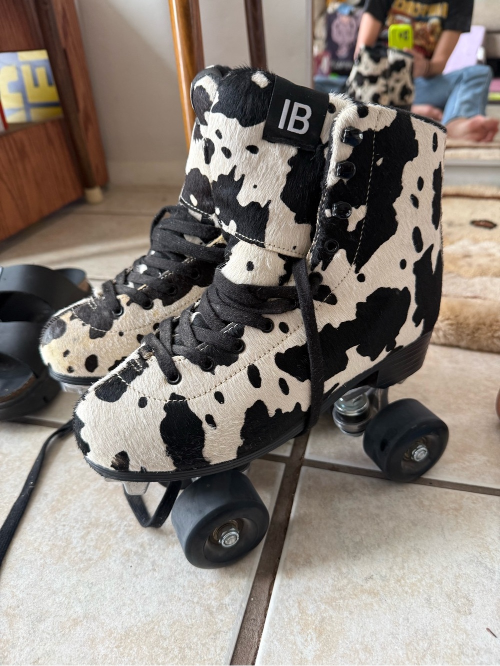 INTENTIONALLY BLANK Black & White Cow-Print Women's Roller Skates